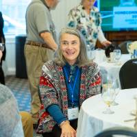 group at table talk about panel